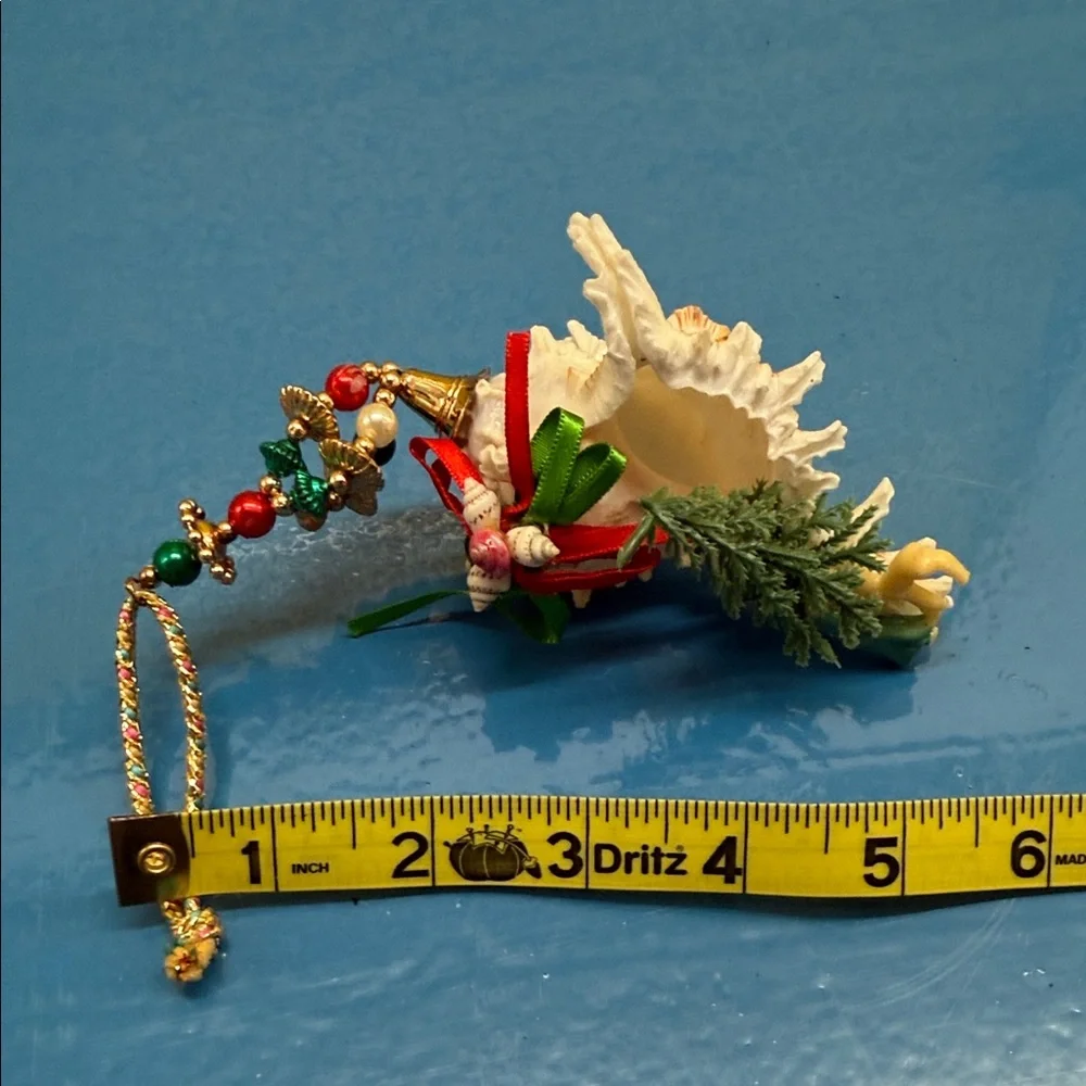 Elegant Shell Ornament with Pink and Green Accents